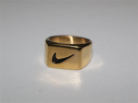 nike ring goud|Gold Nike Ring .